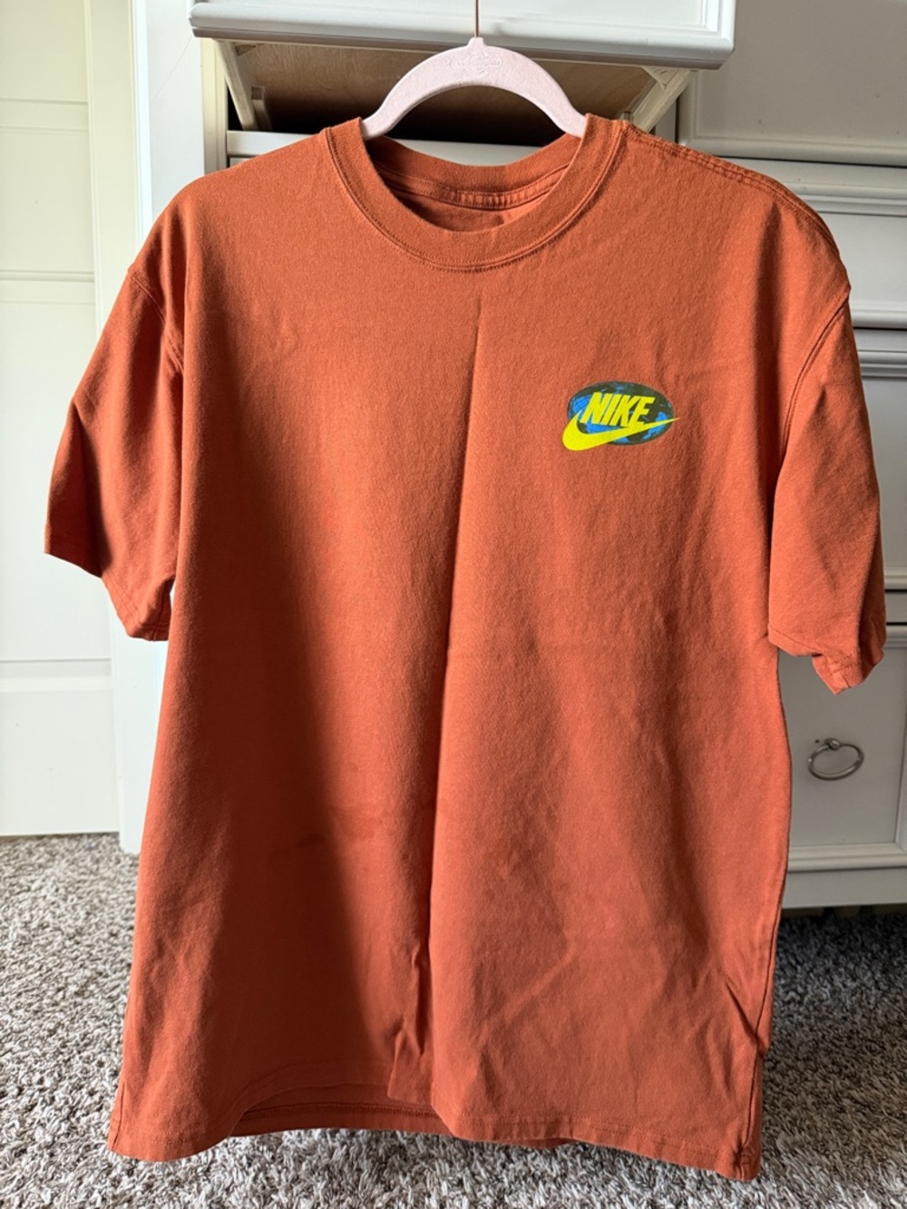Nike Orange Tee with Blue, White & Yellow Graphic